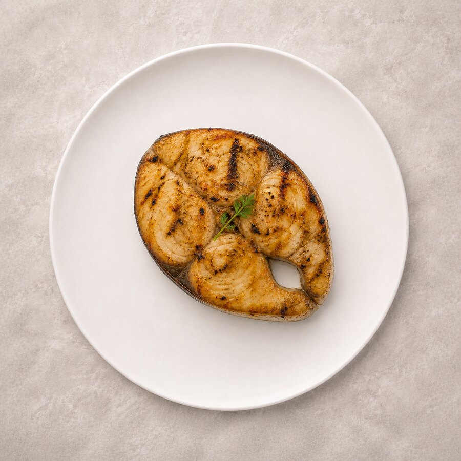 Grilled king fish offer with rice, bread, hummus, salad and lemon mint juice