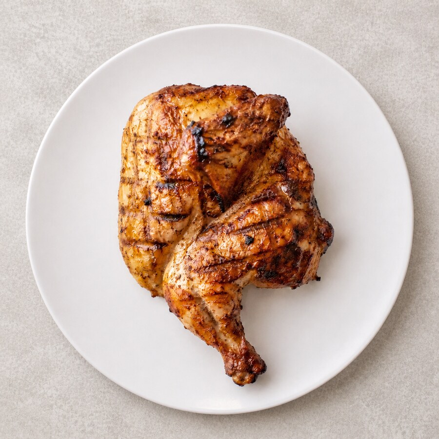 Grilled chicken offer with rice, bread, hummus, salad and lemon mint juice